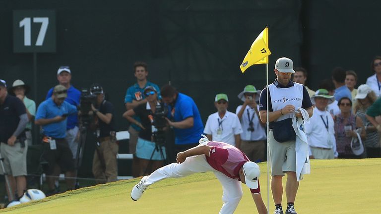 Sergio Garcia collects his ball after his hole-in-one at the 17th at TPC Sawgrass in the 2017 Players Championship 