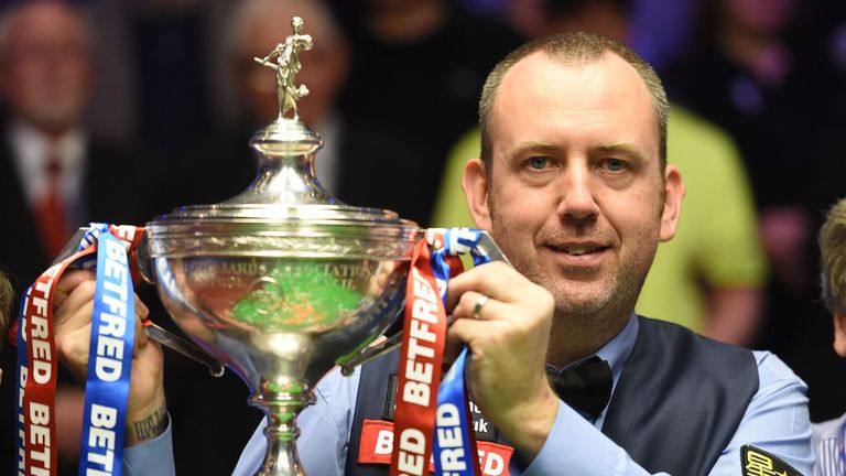 Mark Williams celebrates with the World Snooker Championship trophy