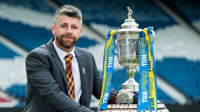 Motherwell manager Stephen Robinson poses alongside the Scottish Cup trophy ahead of the 2018 final against Celtic