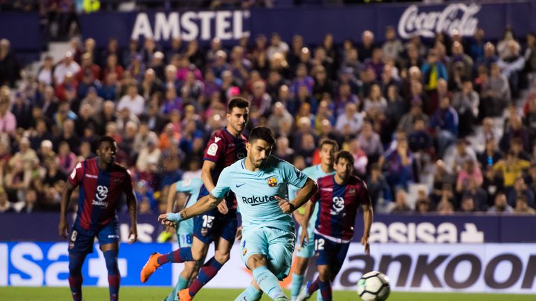 Luis Suarez strokes in his penalty to give Barcelona hope of a comeback