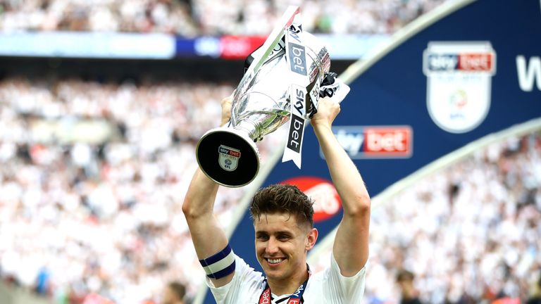 Matchwinner Tom Cairney celebrates with the Championship play-off trophy