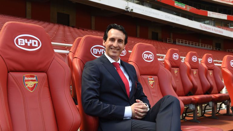 Arsenal's new Head Coach Unai Emery poses for photographs during his unveiling at the Emirates Stadium on May 23, 2018