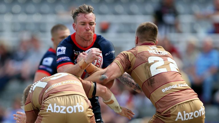 Matty Ashurst powers into the Huddersfield defence