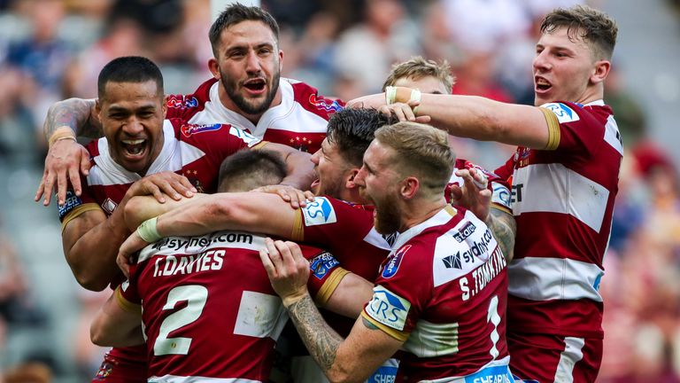 Wigan players celebrate their win over Warrington