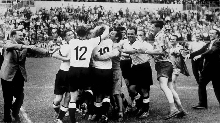 The German Team celebrate after they won the FIFA World Cup 1954 final match between Hungary and West Germany on July 4, 1954 in Bern