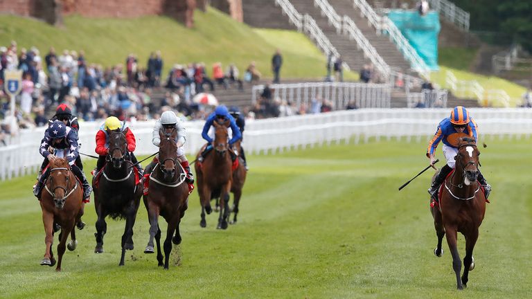 Rostropovich (right) ridden by Ryan Moore wins the HomeServe Dee Stakes at Chester