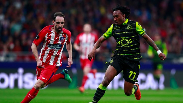 Gelson Martins (R) of Sporting CP competes for the ball with Diego Godin (L) of Atletico de Madrid during the UEFA Europa League quarter final leg one match between Club Atletico Madrid and Sporting CP at Wanda Metropolitano stadium on April 5, 2018 in Madrid, Spain