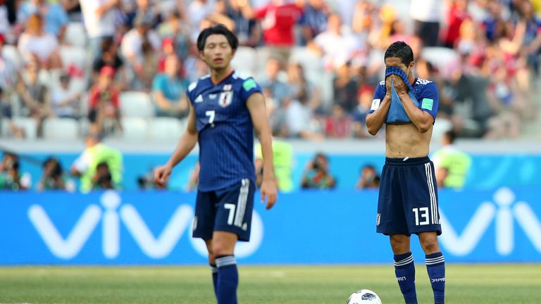 Japan players react after conceding against Poland