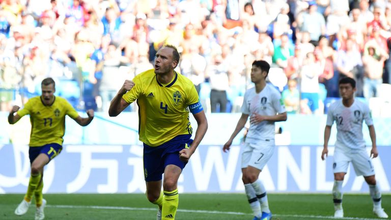 Andreas Granqvist celebrates after converting his penalty