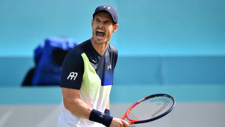 Britain's Andy Murray reacts to Australia's Nick Kyrgios during their first round men's singles match at the ATP Queen's Club Championships tennis tournament in west London on June 19, 2018