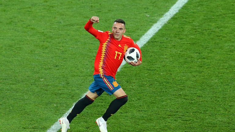 Iago Aspas scored a late equaliser for Spain to secure top spot in Group B