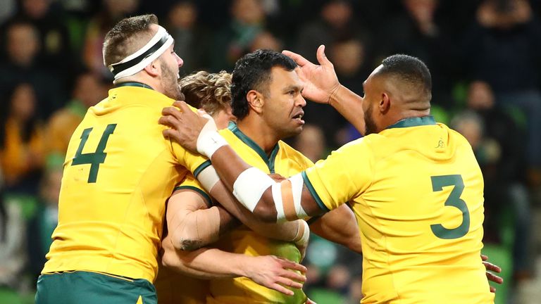 Kurtley Beale of the Wallabies is congratulated by his teammates after scoring a try against Ireland