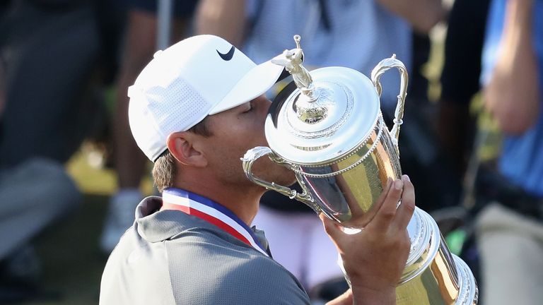 Brooks Koepka kisses the trophy during the final round of the 2018 U.S. Open at Shinnecock Hills Golf Club on June 17, 2018 in Southampton, New York.