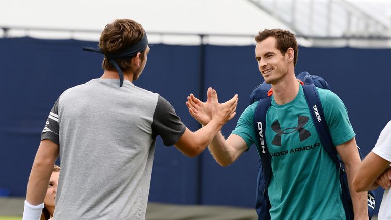 Cameron Norrie and Andy Murray shake hands at Queen's practice session