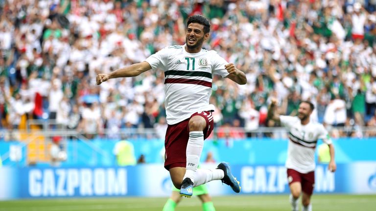 Carlos Vela celebrates after scoring a penalty for Mexico against Japan