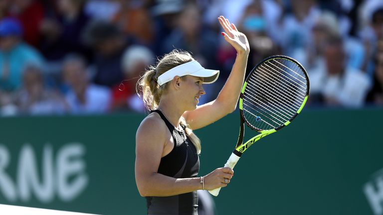 Caroline Wozniacki celebrates her win over Britain's Johanna Konta