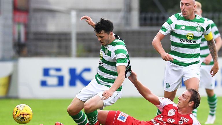 Celtic's Lewis Morgan (left) is tackled by Nediljko Kovacevic.