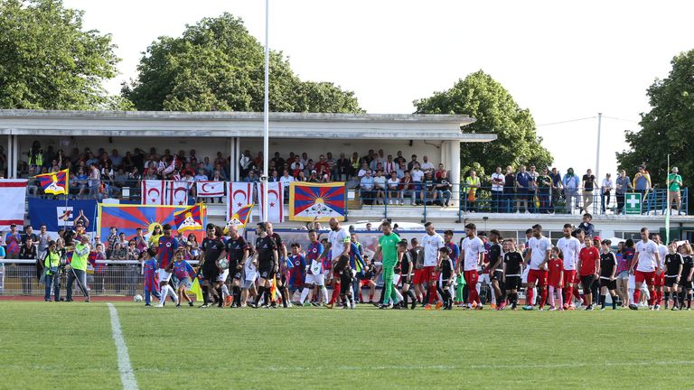 Teams emerge during the CONIFA World Football Cup 2018 match between Northern Cyprus and Tibet at Enfield Town on June 2, 2018 in London, England. (Photo by Con Chronis/CONIFA)