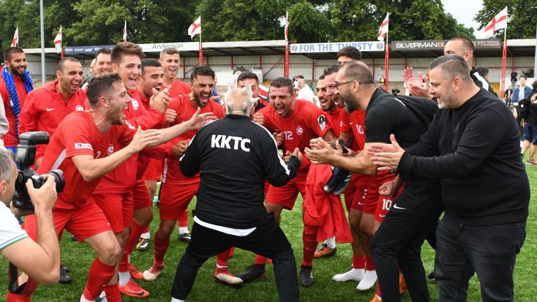 Northern Cyprus players and staff celebrate on the pitch after their 3-2 victory in the Confederation of Independent Football Association (CONIFA)'s 2018 World Football Cup semi-final match between Northern Cyprus and Padania at Colston Avenue Football Stadium in Carshalton, north London, on June 7, 2018. (Robin Millard / AFP)