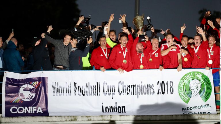 Karpatalya players celebrate with the trophy after victory over Northern Cyprus in the final of the CONIFA World Football Cup at Enfield (Con Chronis/CONIFA)