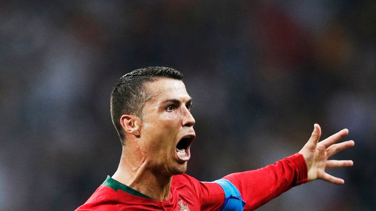 Cristiano Ronaldo celebrates scoring his third goal during the Russia 2018 World Cup Group B football match between Portugal and Spain at the Fisht Stadium in Sochi on June 15, 2018