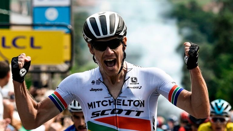 South Africa's Daryl Impey celebrates after he crossed the finish line to win the first stage ahead of France's Julian Alaphilippe (Rear L) of the 70th edition of the Criterium du Dauphine cycling race between Valence and Saint-Just-Saint-Rambert, southeastern France, on June 4, 2018