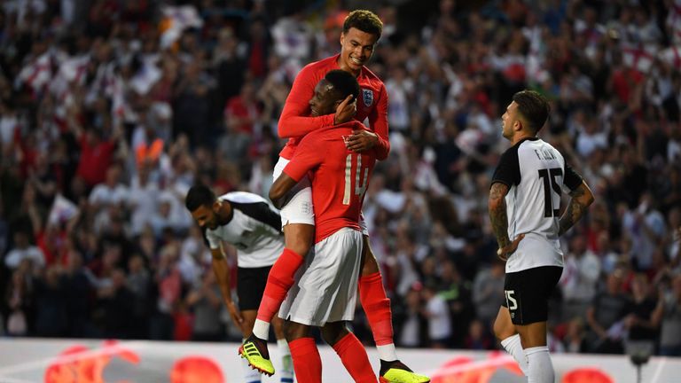 Danny Welbeck and Dele Alli celebrate England's second goal