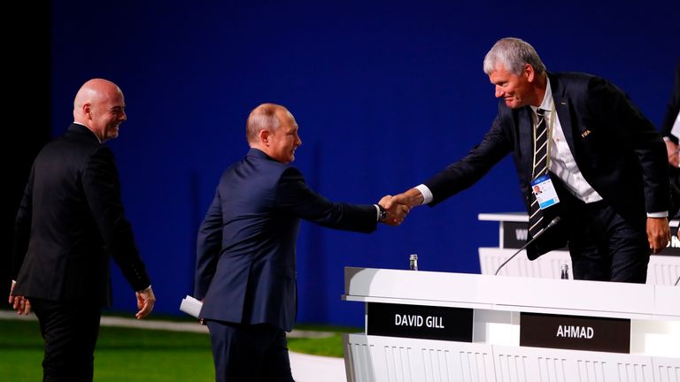 President of Russia, Vladimir Putin shakes hands with FIFA Vice President David Gill as FIFA President Gianni Infantino on during the 68th FIFA Congress at the Moscow Expocentre