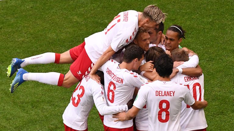 Denmark's Christian Eriksen gets mobbed by team-mates after scoring during their group C match with Australia