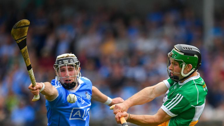Tom Spain of Offaly in action against Jake Malone of Dublin