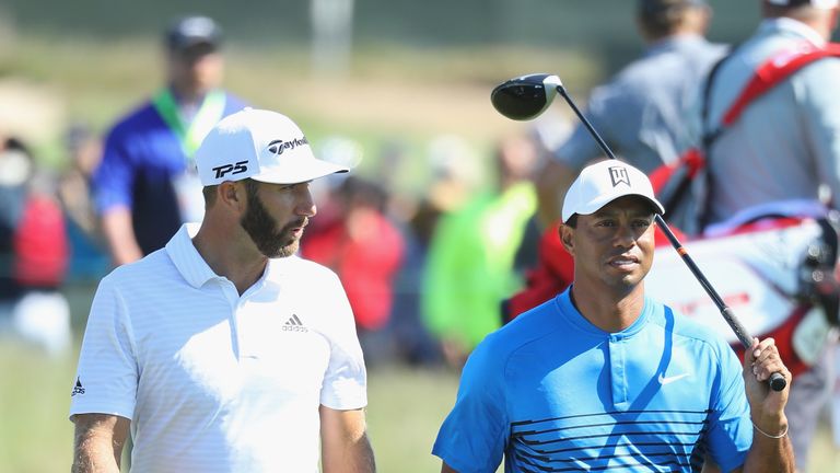Dustin Johnson and Tiger Woods during a practice round prior to the 2018 U.S. Open at Shinnecock Hills Golf Club on June 12, 2018 in Southampton, New York.