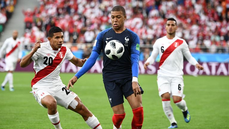 Edison Flores (L) and Kylian Mbappe in action during the group C match in Ekaterinburg