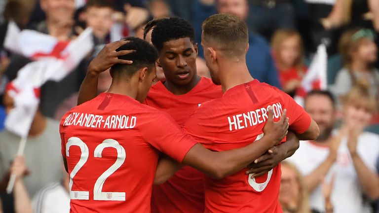 England's striker Marcus Rashford (C) celebrates with teammates after scoring the opening goal during the International friendly football match between England and Costa Rica at Elland Road, Leeds in northern England on June 7, 2018. - England won the game 2-0