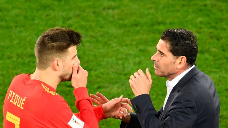 Fernando Hierro speaks with Spain defender Gerard Pique during their 2-2 World Cup draw with Morocco