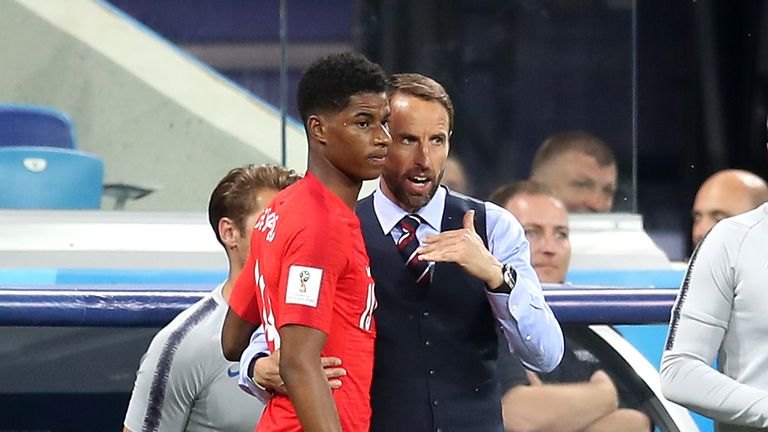 England manager Gareth Southgate gives Marcus Rashford some last-minute instructions before introducing him against Tunisia