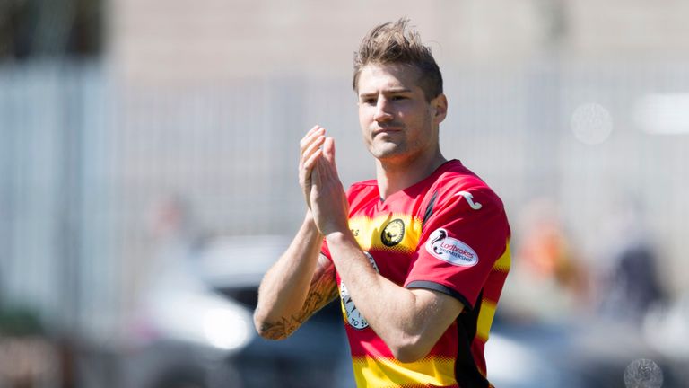 Partick Thistle's Frederic Frans applauding the fans at the end of the game.