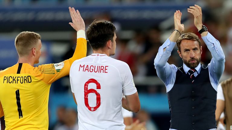 Gareth Southgate applauds England fans following the 1-0 loss to Belgium in their final group G match
