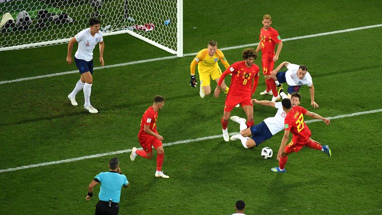 Gary Cahill dives to make a tackle during Belgium's 1-0 win over England