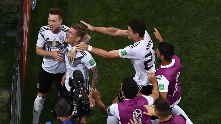 Germany players celebrate Toni Kroos' last-gasp winner against Sweden