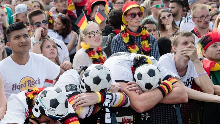 Supporters of the German national react to the 2-0 loss to South Korea that resulted in their elimination from the 2018 World Cup