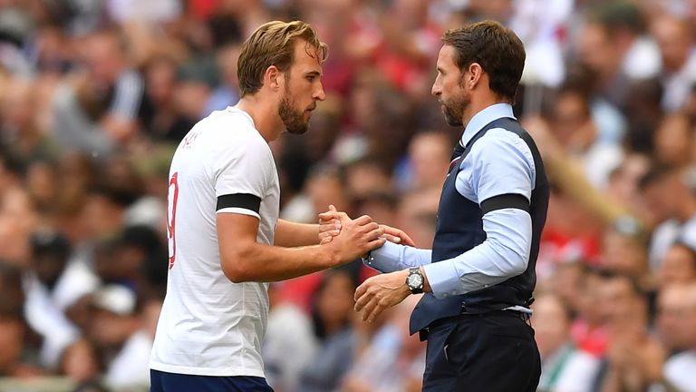 Harry Kane and Gareth Southgate embrace during England's match against Nigeria at Wembley