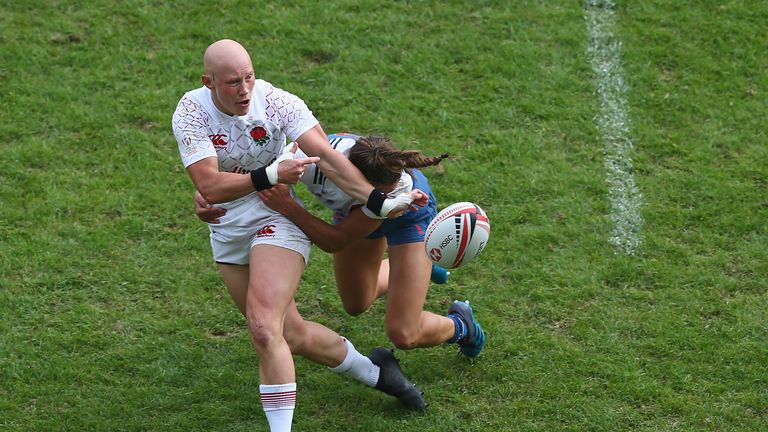 Heather Fisher of England is tackled by Lina Guerin of France during the Women's Cup quarter final match between France and England during the HSBC Paris Sevens at Stade Jean Bouin