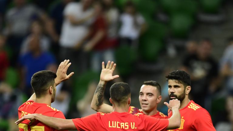 Spain team-mates celebrate Iago Aspas' (second right) goal in the win over Tunisia