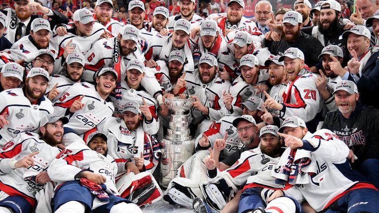 The Washington Capitals players celebrate after winning the Stanley Cup