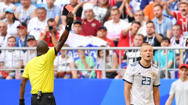 Malang Diedhiou shows a red card to Russian defender Igor Smolnikov