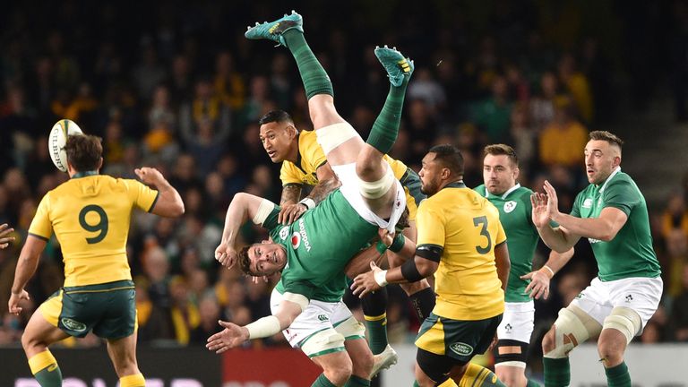 Australia's Israel Folau contests a high ball with Ireland's Peter O'Mahony