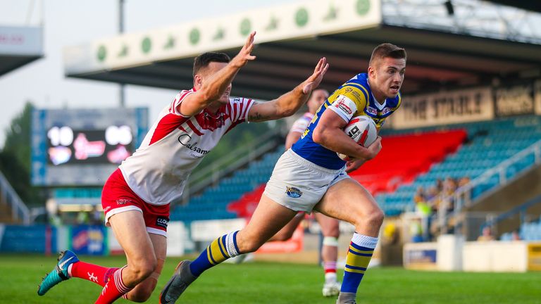 Jack Walker of Leeds runs in for a try against Leigh Centurions in the Challenge Cup