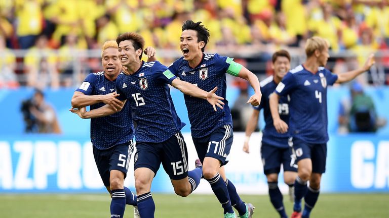 Japan celebrate during the 2018 FIFA World Cup Russia group H match against Colombia at Mordovia Arena on June 19, 2018 in Saransk, Russia