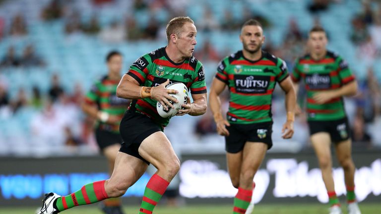 Jason Clark of the Rabbitohs runs with the ball during the NRL trial match.