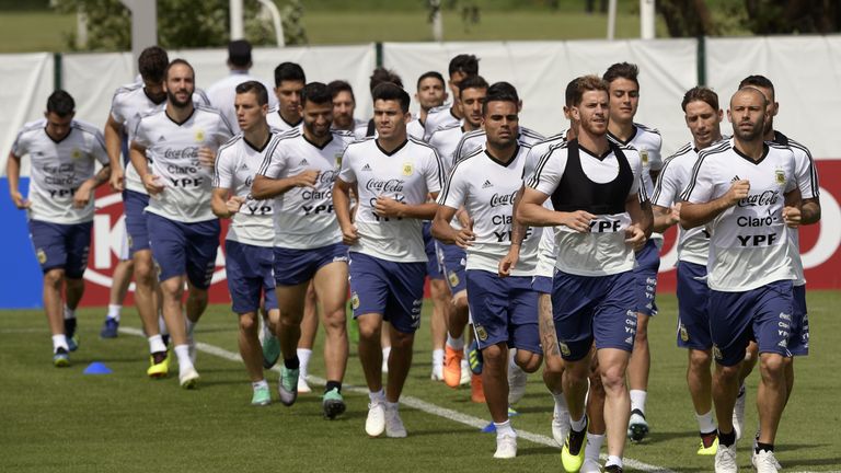 Argentina's Javier Mascherano (R) leads teammates in a training session at the team's base camp in Bronnitsy on Sunday